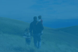 Family hiking in the hills, representing estate planning for family future.