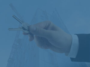 Businessman holding keys to signify business relocation