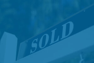 Sold sign in front of house