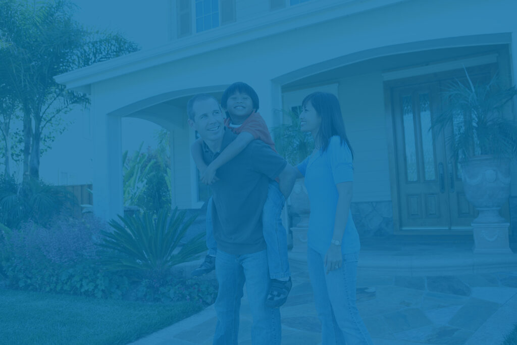 Family in front of house - family tax planning concept