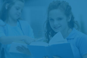 Two girls reading books, concept for roth ira for kids