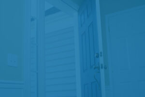 Open door with key, representing short-term rental property