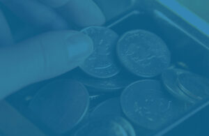 Dollar coins in cash register, representing FDIC insurance for bank accounts