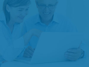 Business owners with laptop, representing diversified portfolio for entrepreneurs.