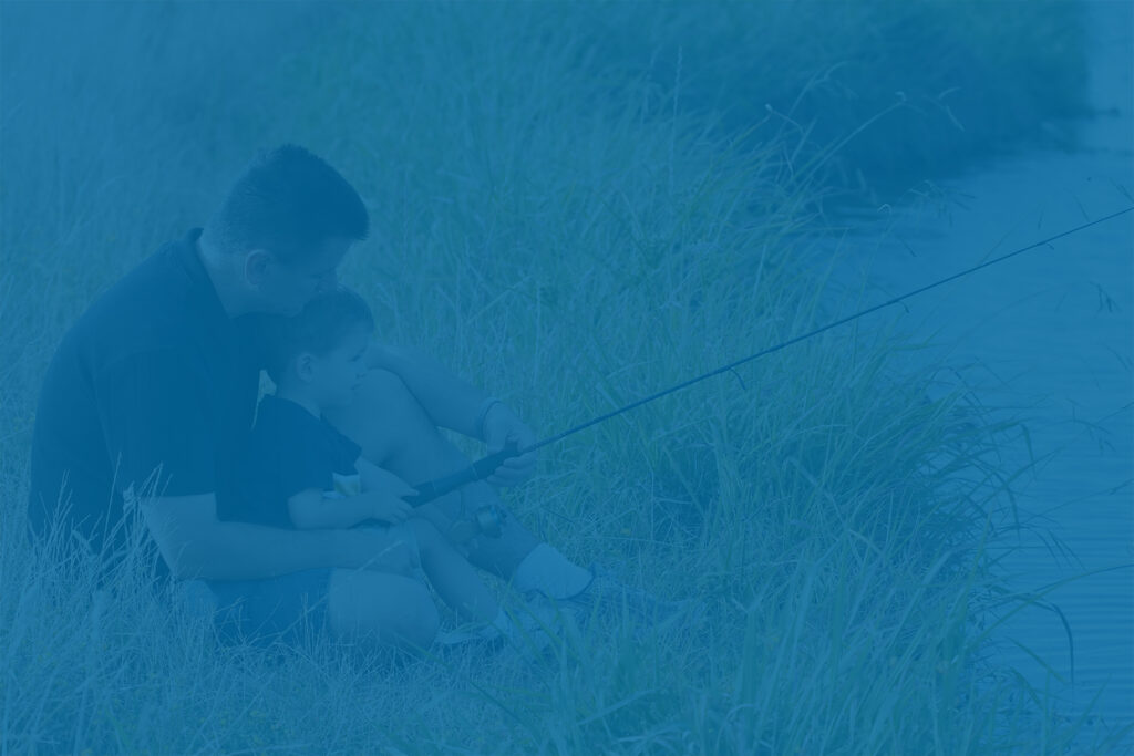 Father and son fishing, representing personal priorities and year-end financial review for individuals and families.