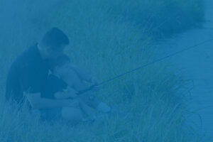Father and son fishing, representing personal priorities and year-end financial review for individuals and families.