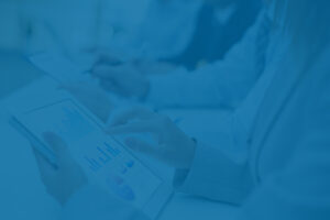 Businesswoman reviewing financial portfolio, representing gifting appreciated stock.