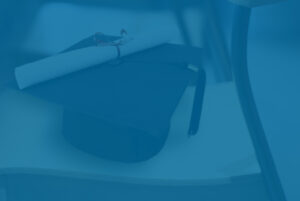 College graduation cap and diploma, representing Section 529 savings plan.